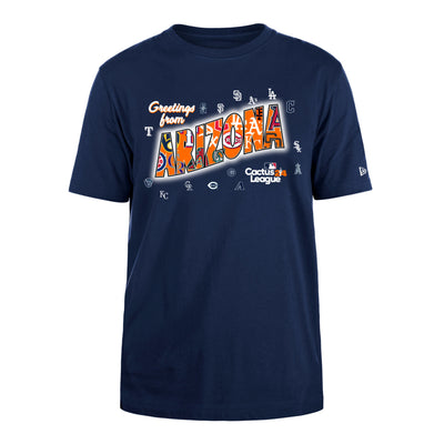 Cactus League navy tee with the cursive text "Greeting from" in white outlined in orange above the text  "Arizona". within the word arizona there is an orange background and all the different baseball team logos that are in the cactus league. Surrounding the text are the small white outlines of all the logos. At the very bottom is the cactus league 24 logo.