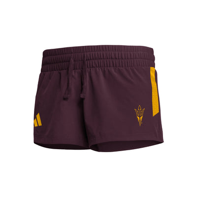 ASU maroon womens shorts with a small pitchfork logo on one leg and a small gold adidas logo on the other with a gold stripe down the side of both legs.