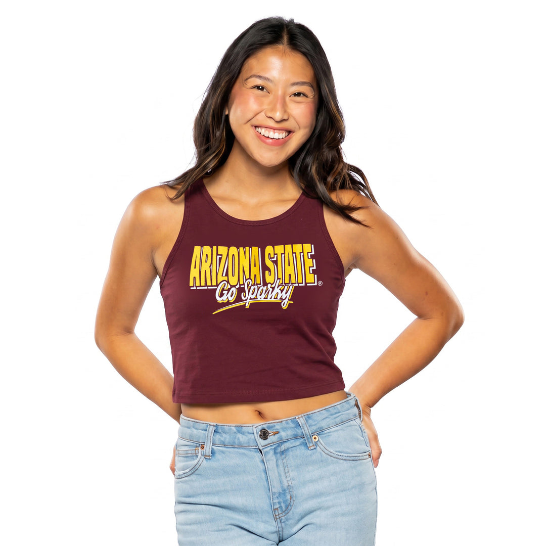 A smiling young woman wearing a maroon cropped tank top with &