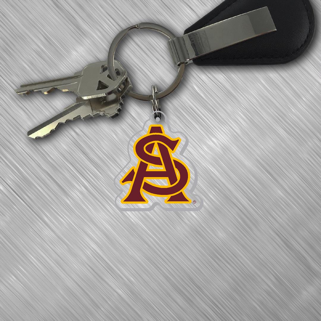 Keychain with a logo on a textured surface