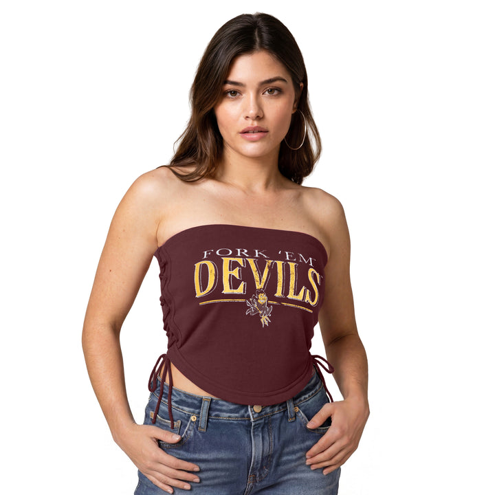 A woman modeling a maroon strapless tube top with &