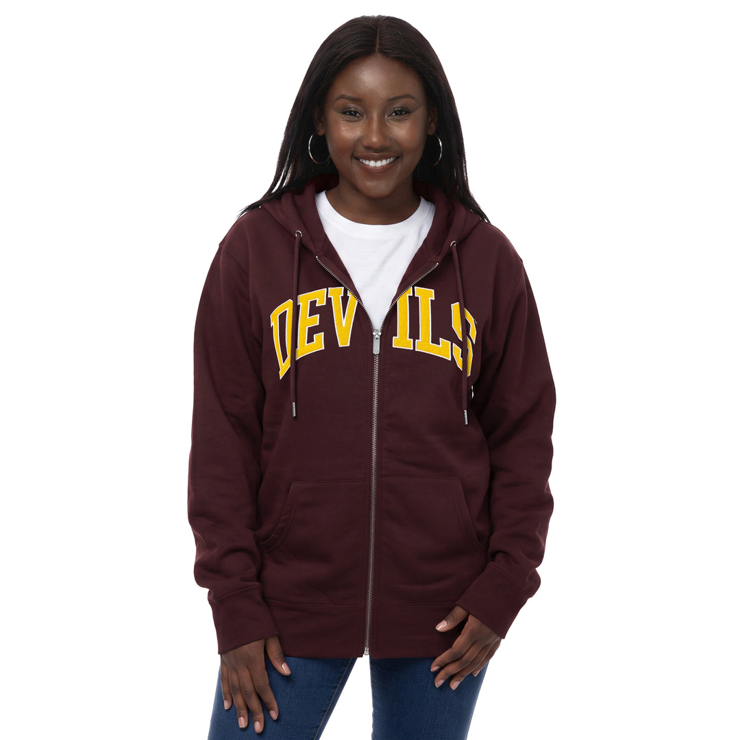 A woman wearing a maroon full-zip hoodie with &