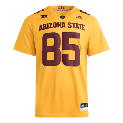 Gold football jersey with Big12 patch embroidered on the right front shoulder and Adidas logo on the left front shoulder. PT42 patch on the front of the collar. #85 on the front and top shoulders in maroon.