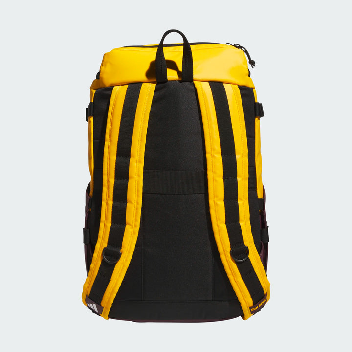 A yellow and black backpack shown from the back, featuring padded shoulder straps, a top carry handle, and side pockets, photographed against a light gray background.