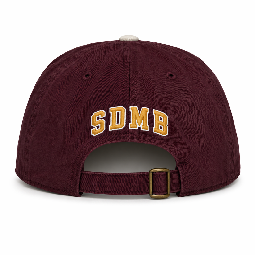 back of maroon adjustable hat with "SDMB" in gold white a white outline