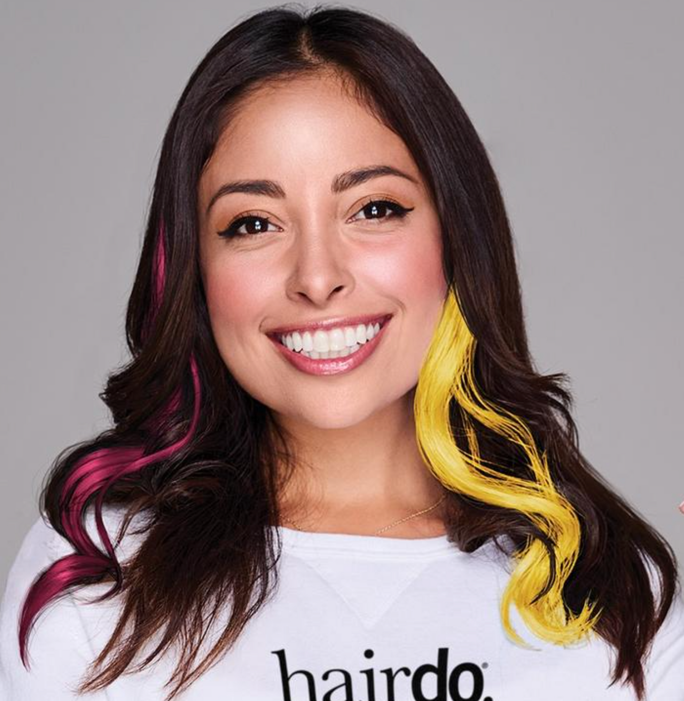 Woman with maroon and gold streaks in her hair.