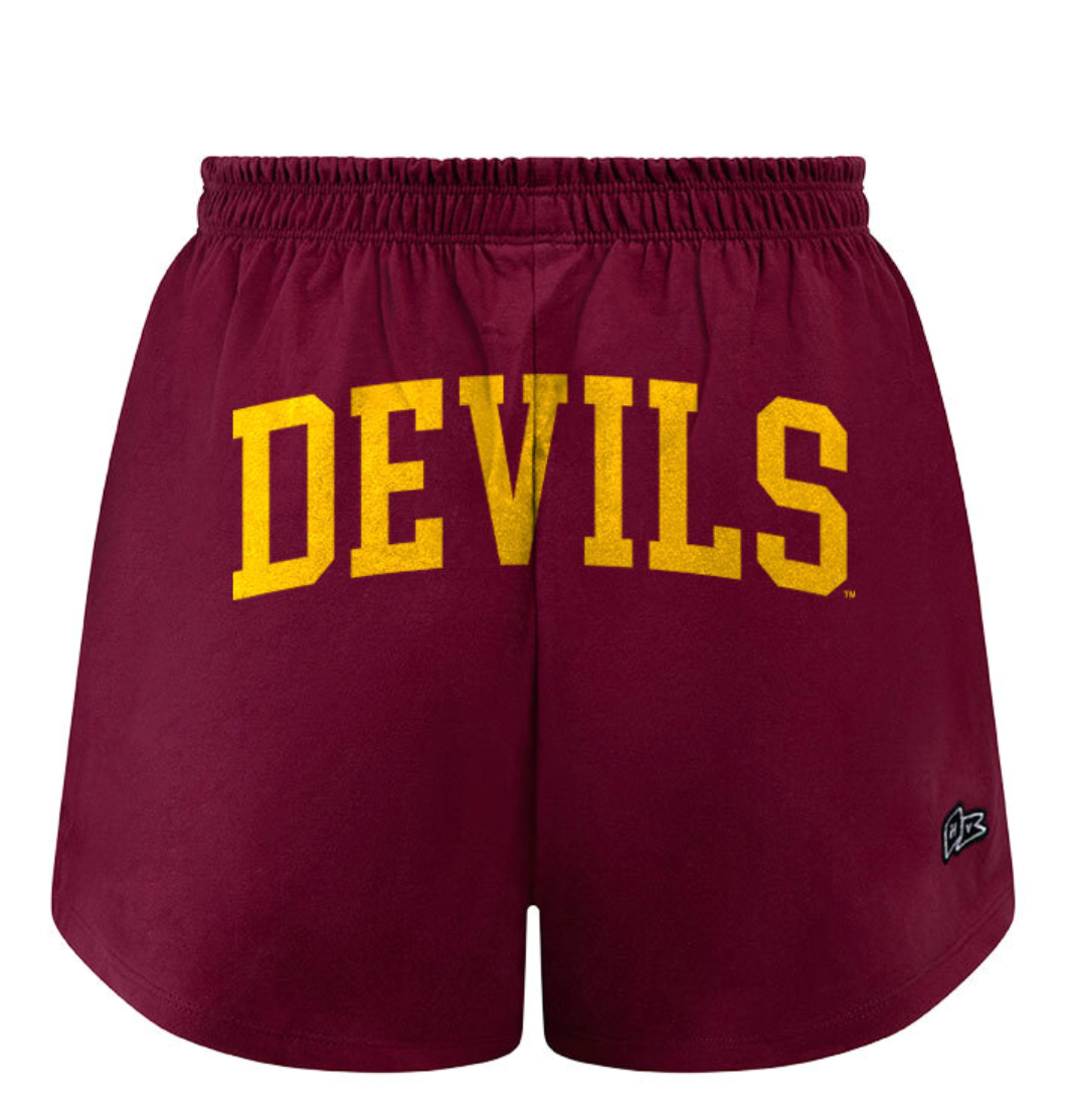 Maroon gym shorts with devil in gold across backside