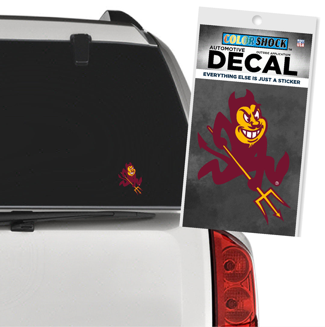Car decal of a maroon devil with a gold background, applied to a car's rear window.