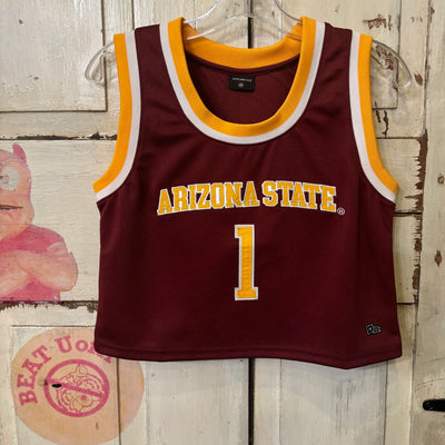 ASU maroon cropped basketball jersey. The ends of the sleeves and collar are outlined by a solid white line and a solid gold line. Across the chest reads "ARIZONA STATE" in gold letters outlined in white. Below this is the number "1"  in large gold text outlined in white.