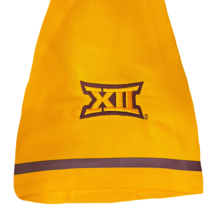 Right sleeve of gold jersey with Big 12 logo outlined in maroon with maroon stripe.