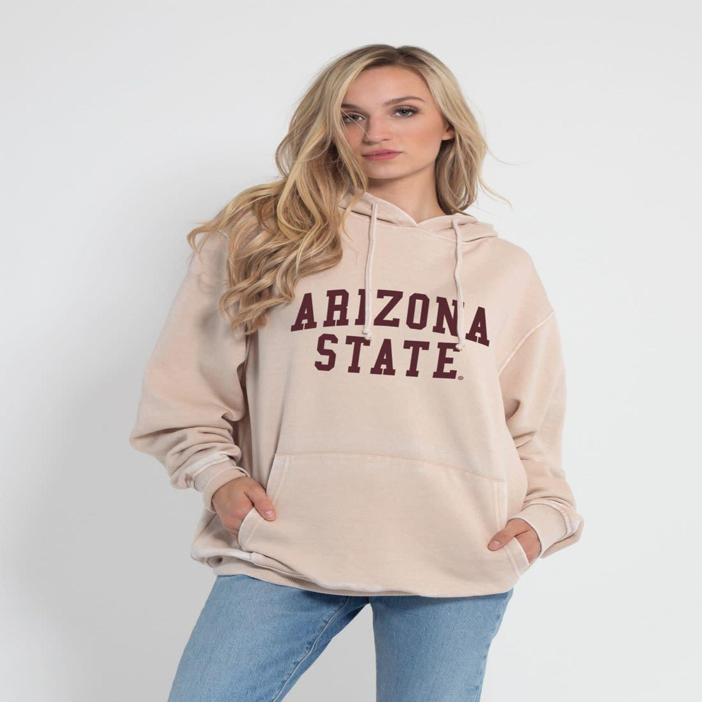 Woman wearing ASU tan hoody with 'Arizona State' in maroon lettering