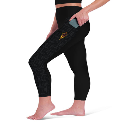 Side profile of ASU black 2 pocket leggings with a pitchfork design on the left leg and repeating a repeating ASU print design on the side panels