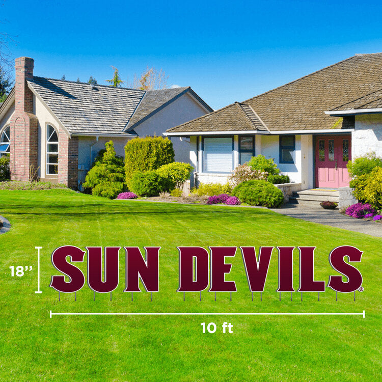 ASU lawn sign in front yard of 'Sun Devils' lettering