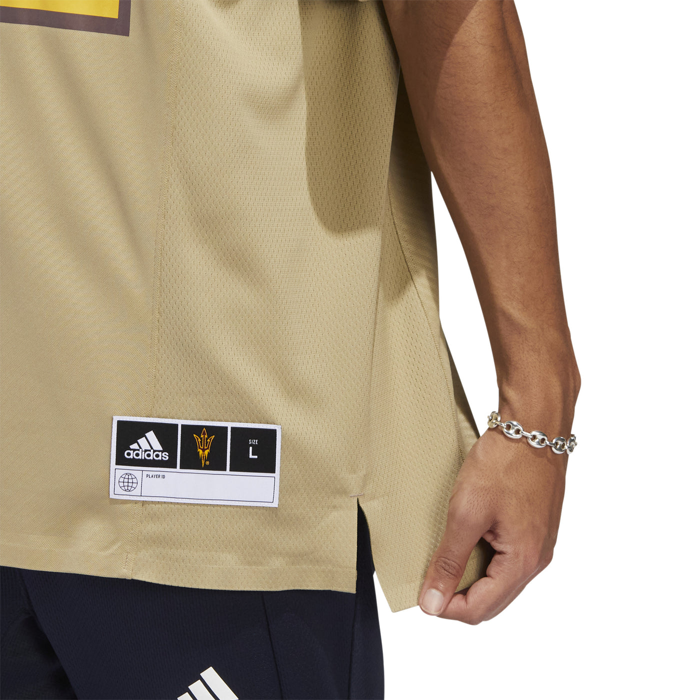 ASU tan football jersey size patch on the front, left side, bottom corner. 