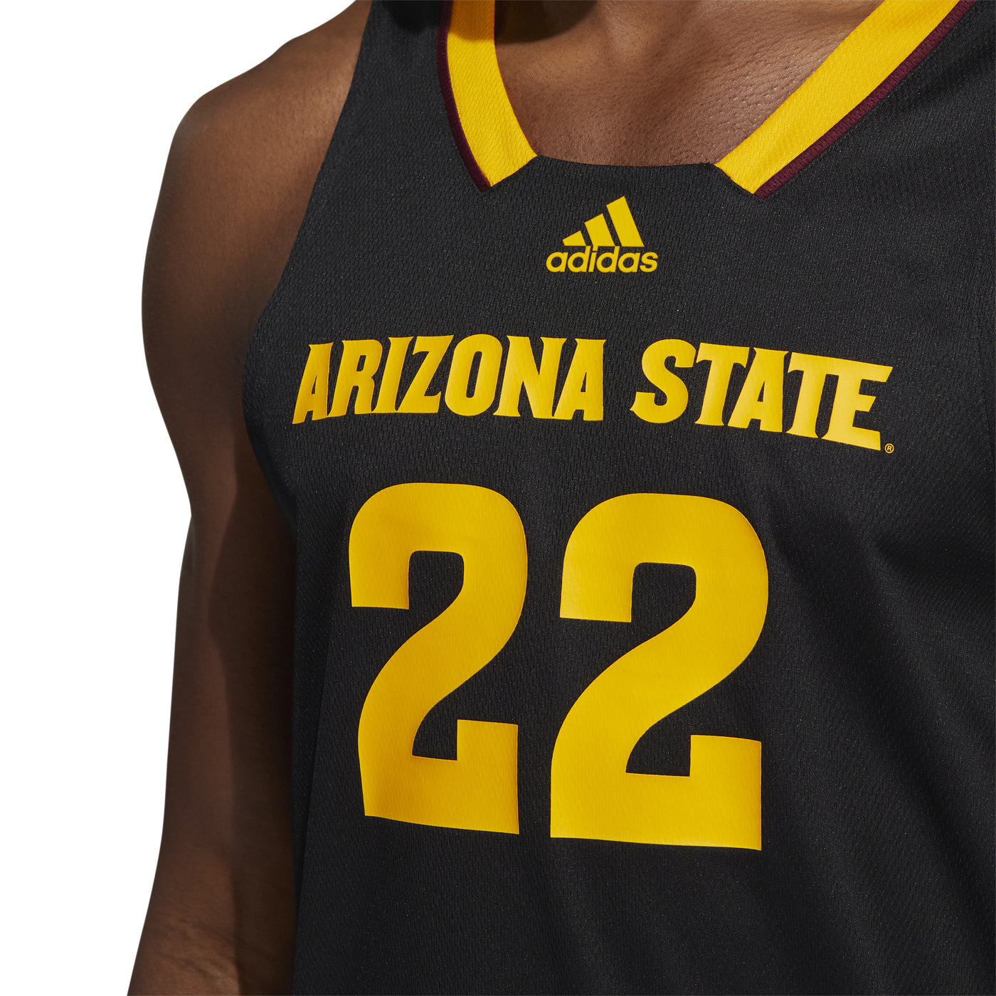 Zoomed in front view of ASU black Adidas basketball jersey with 'Arizona State' letters above '22' and gold features