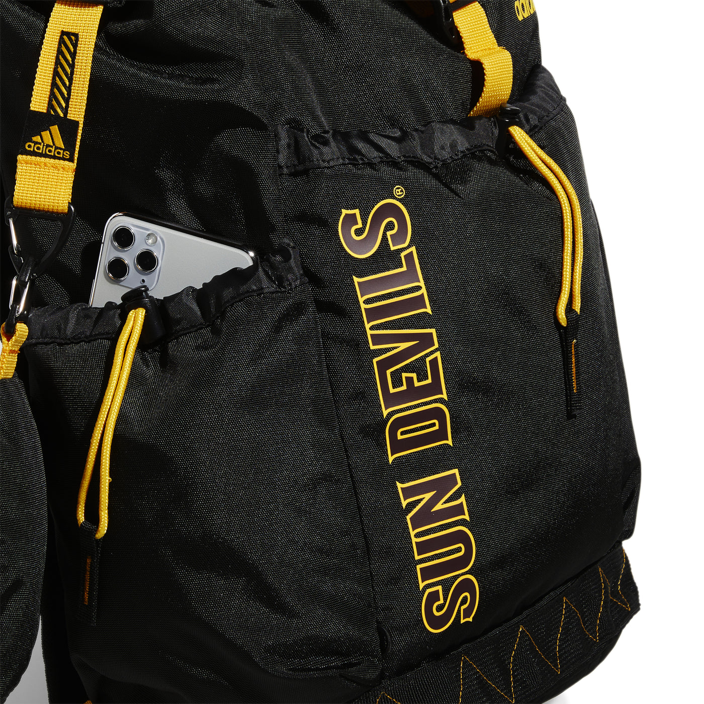 ASU backpack side view showcasing Sundevils outlined in yellow and a phone in the side pocket. 