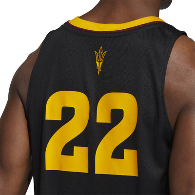 Zoomed in view of the back of ASU black Adidas basketball jersey with '22' below a pitchfork and gold features